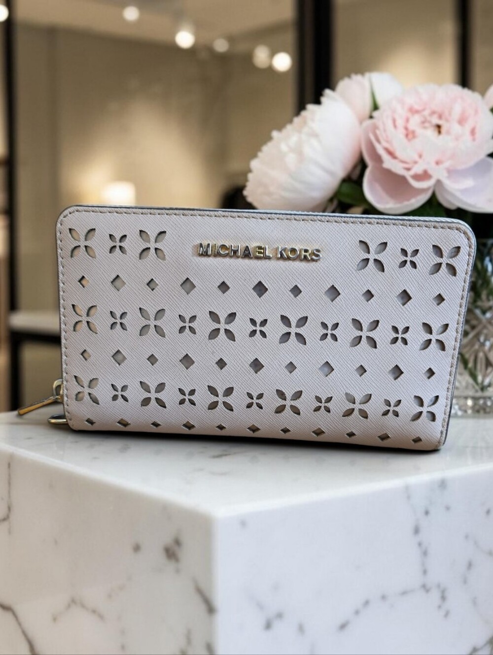 Michael Kors Perforated Floral Zip Wallet in Light Pink
